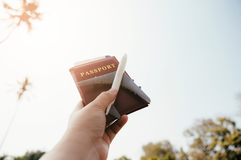 Female tourist holding passport , Travel concept.